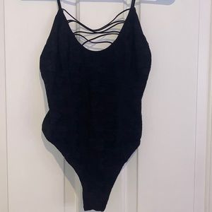 Floral lace bodysuit with criss cross strappy detailing